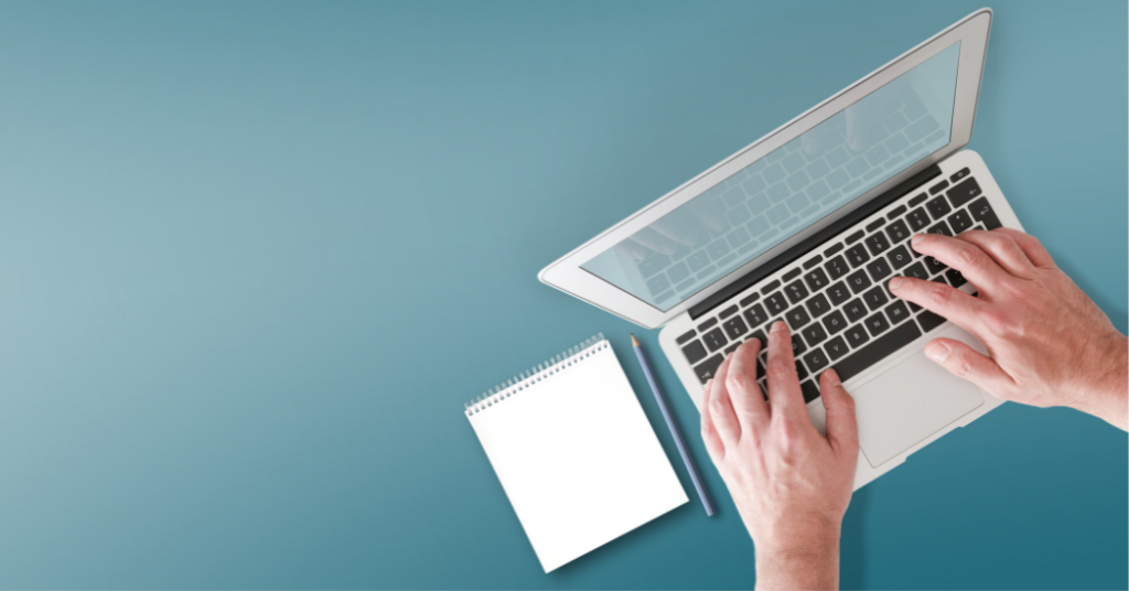 A blue background. The main focus of the image is a person on a laptop, with a notebook beside them